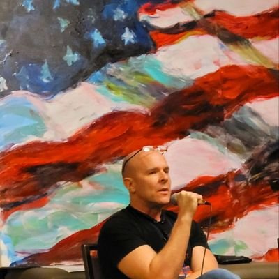 Patrick Gunnels speaking at event